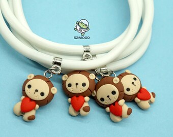 Rubber bracelet, adjustable to size, with handmade polymer clay pendant, lion