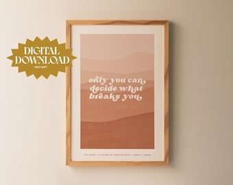 May include: A framed print with a peach, pink, and brown abstract background. The text "only you can, decide what breaks you" is written in white on the print. The print is titled "The Suriel - A Court of Wings & Ruin - Sarah J. Maas".