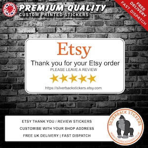 May include: White sticker with the text "Etsy" in orange, "Thank you for your Etsy order" in black, and "PLEASE LEAVE A REVIEW" in black. Five gold stars are below the text. The URL "https://silverbackstickers.etsy.com" is at the bottom of the sticker. The sticker is on a black brick wall.