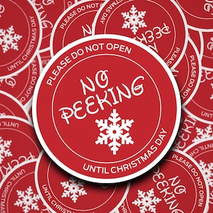 May include: Red and white circular gift tags with the text "Please do not open until Christmas Day" and "No peeking until Christmas Day". The tags feature a snowflake design.