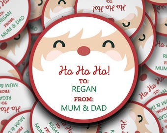 Adesivi natalizi personalizzati "Santas Face Ho Ho Ho". Festeggia le festività con questi adesivi regalo personalizzati.