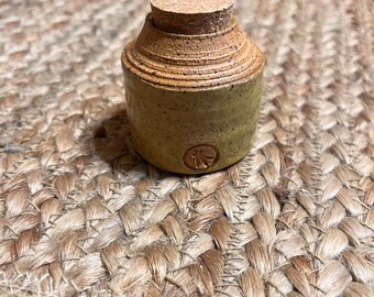 Medium  green corked vessel