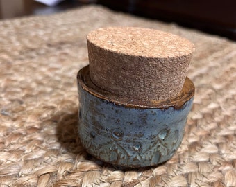 Medium blue carved corked vessel