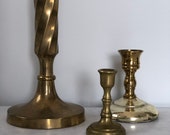 Set of three brass candlesticks
