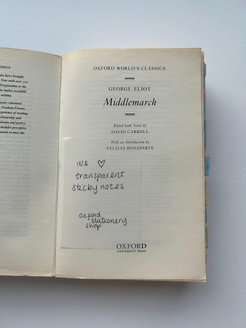 May include: A close-up of a book cover for the Oxford World's Classics edition of "Middlemarch" by George Eliot. The cover is cream-colored with black text. The book is edited with notes by David Carroll and has an introduction by Felicia Bonaparte.