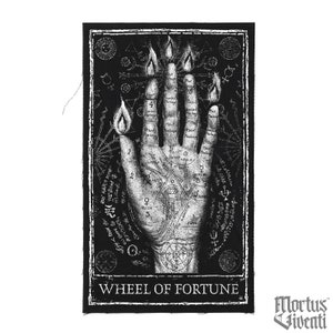 May include: A black and white tarot card with a hand with flames on the fingers. The card is titled "Wheel of Fortune" and has a variety of symbols and text on it. The card is from the Mortus Fiventi tarot deck.