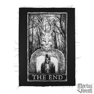 May include: Black and white embroidered patch featuring a rabbit monster with a skeletal figure in front of it. The patch has the text "THE END" at the bottom and the words "Mortus Viventi" at the bottom right.