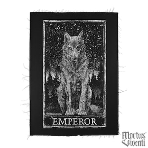 May include: Black and white embroidered patch with a wolf sitting in a starry night forest. The patch has the word "EMPEROR" written below the wolf.