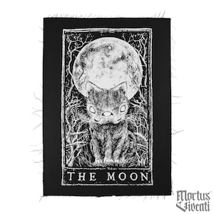 May include: Black and white embroidered patch with a cat in front of a full moon. The text "THE MOON" is at the bottom of the patch.