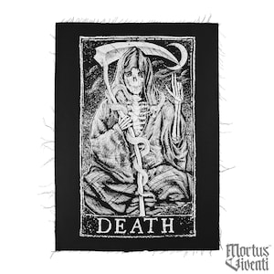 May include: Black and white embroidered patch featuring a skeletal figure in a hooded robe holding a scythe and a snake. The figure is sitting with its legs crossed. The text "DEATH" is printed below the figure.