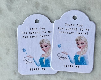 May include: Two white thank you tags with a blue and white illustration of a princess with blonde hair. The text on the tags reads "Thank you for coming to my birthday party!" and "Love, Kirra XX".
