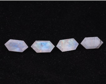 May include: Four iridescent moonstone gemstones, each cut into a hexagonal shape with rounded edges. The stones are a pale white with a subtle blue sheen.