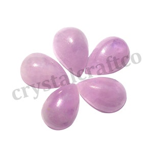 May include: Five pale pink teardrop-shaped cabochons, likely amethyst, arranged in a flower pattern.