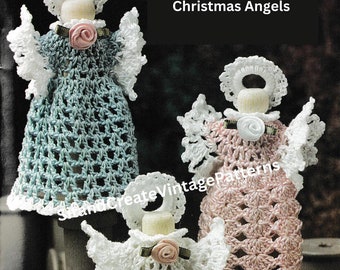 May include: Three crocheted Christmas angels, one in white, one in pink, and one in blue, with white haloes and a small pink flower on each. The angels are sitting on spools of thread.