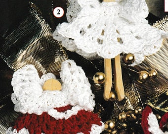 May include: Three crocheted angel ornaments with white wings and dresses. The dresses are white, red and white, and white with red trim. The ornaments are attached to wooden clothespins.