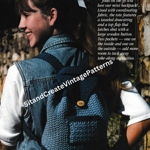 May include: A blue crocheted mini backpack with a wooden button closure, a top flap, and two pockets. The backpack is being worn by a young person wearing a denim vest and a white shirt.