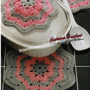 May include: Two crocheted gray and pink star-shaped pot holders. The pot holders are made with a simple stitch pattern and have a scalloped edge. The text "Instant Crochet Vintage Patterns in a little time..." is visible in the image.