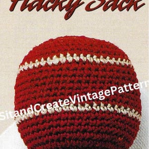May include: A red and white crocheted hacky sack. The ball is primarily red with two white stripes. The text "Hacky Sack" is at the top of the image in a cursive font. The text "SitandCreateVintagePattern" is at the bottom.