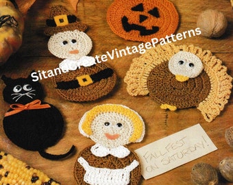 May include: Crochet patterns for a variety of Thanksgiving and Halloween characters, including a pilgrim, a turkey, a pumpkin, a black cat, and a colonial woman. The patterns are displayed on a wooden surface with fall decorations.