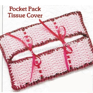 May include: A handmade crochet pocket tissue cover in pink and burgundy. The cover features a textured stitch pattern and is accented with a burgundy border and pink ribbon ties. The text "Pocket Pack Tissue Cover" is visible.