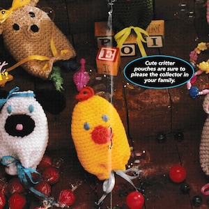 May include: Five crocheted animal pouches, including a dog, a chick, a mouse, and two other animals. The pouches are made with different colored yarn and have embroidered faces. The text "Make it TONIGHT!" is visible in the image.