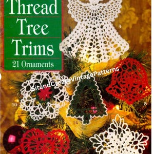 May include: A vintage book cover titled "Thread Tree Trims" with 21 ornament patterns. The image showcases various handmade crochet Christmas ornaments in white, red, and green, including an angel, snowflakes, a heart, and a Christmas tree.