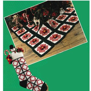 May include: A crocheted Christmas stocking with a snowman and candy cane design. The stocking is red, white, and green. A crocheted Christmas tree skirt with a poinsettia design is in the background.