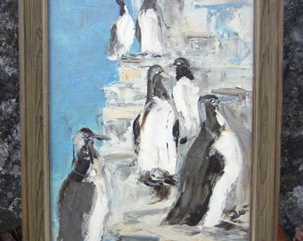 May include: A framed painting of a group of penguins in a snowy landscape. The penguins are painted in shades of white, black, and gray. The painting is set against a blue sky and a white snowy background.