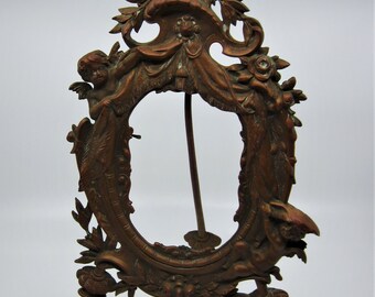 Antique French bronze frame Decorated with cherubs, halberds, curtain, laurel & roses Rococo style Impressive High quality 1800s gift France
