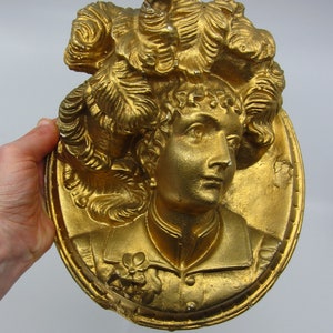 Lovely vintage / antique oval gilt plaster wall plaque with a young Lady&#39;s face in high relief Renaissance / Victorian / Belle epoque style