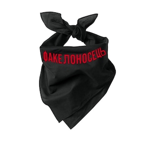 May include: Black bandana with red embroidered text. The bandana is tied at the top. The text is in a bold, sans-serif font. The ends of the bandana hang down.