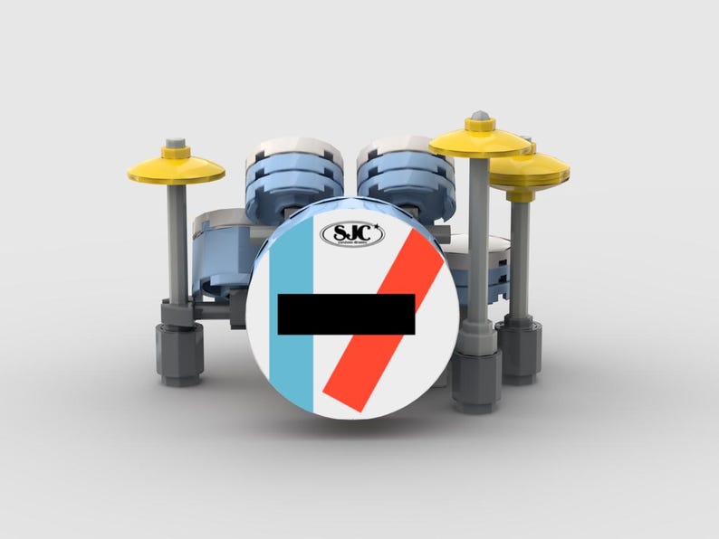 May include: A miniature drum set made of building blocks. The bass drum is white with a black stripe and a red and blue stripe. The set includes light blue drums, yellow cymbals, and gray stands.