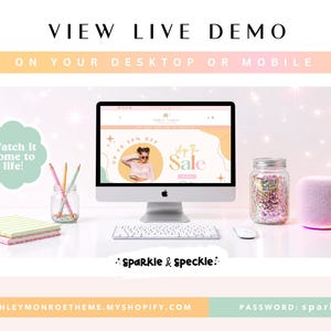 May include: A desktop setup featuring an Apple computer displaying a website with a sale banner. The scene includes a keyboard, mouse, a jar filled with glitter, a pink speaker, and pencils in a jar. Text reads "VIEW LIVE DEMO" and "Watch it come to life!"