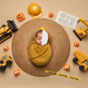 May include: A newborn baby wrapped in a yellow swaddle and hat, surrounded by toy construction vehicles, orange traffic cones, and a yellow hard hat. A brown hat serves as the backdrop, with a yellow caution tape at the bottom.