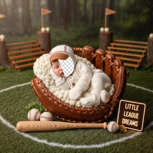 Peut inclure: Un nouveau-né, vêtu d'un ensemble de baseball, est niché dans un gant de baseball rempli d'une matière blanche et douce. Une batte et des balles de baseball sont à proximité, avec une enseigne "LITTLE LEAGUE DREAMS".