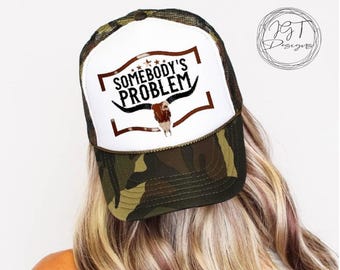 Somebody’s Problem Camo Trucker Hat