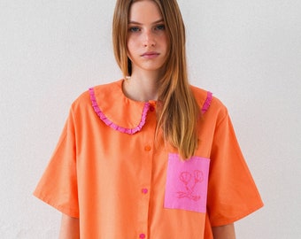 Hand Embroidered vibrant shirt in coral orange and hot pink details