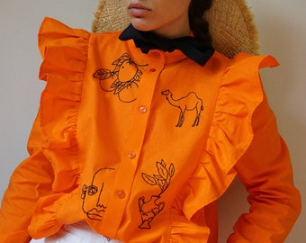 Hand embroidered orange cowboy shirt with ruffles