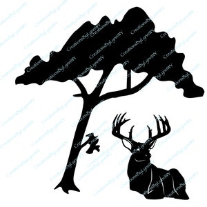 May include: A black silhouette of a deer with large antlers standing under a tree with a thick trunk and branches.