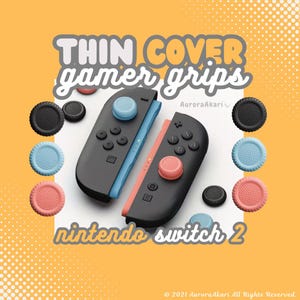 May include: Image of black Nintendo Switch controllers with blue and coral accents, and matching thumb grips. The text "THIN COVER gamer grips" and "nintendo switch 2" are displayed on an orange background.
