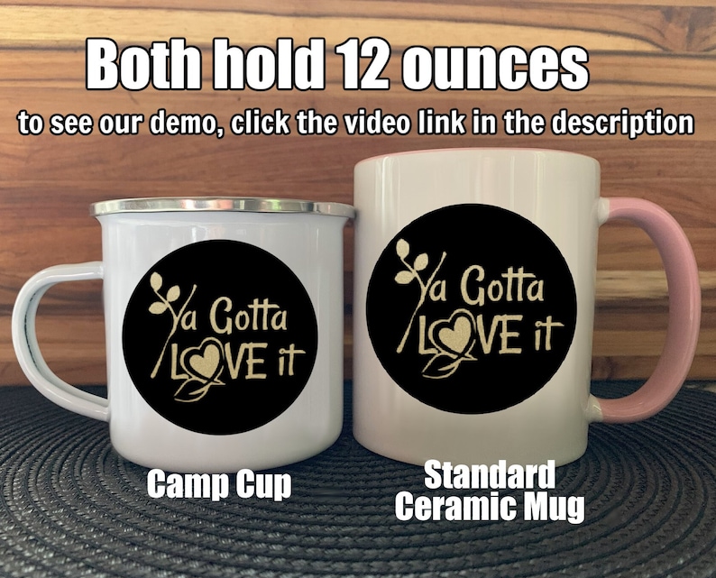 May include: Two mugs, one a white enamel camp cup and the other a white ceramic mug with a pink rim, both with a black circle design that says "Ya Gotta LOVE it" in gold lettering. Both mugs hold 12 ounces.