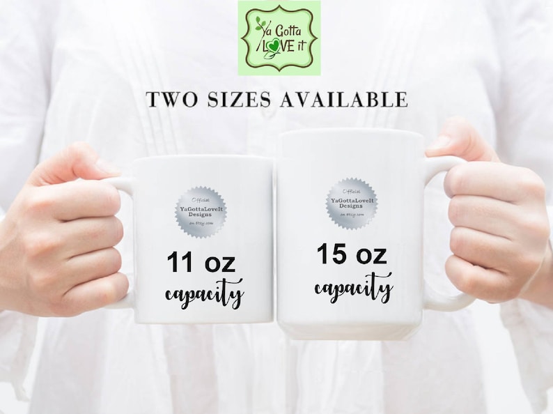 May include: Two white ceramic mugs with black text. The mug on the left is 11 oz and the mug on the right is 15 oz.