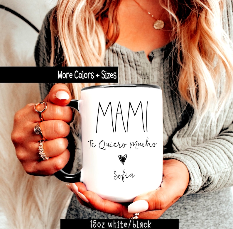 May include: White ceramic mug with a black rim and handle. The mug has black text that reads "Mami Te Quiero Mucho" with a heart and the name "Sofia".