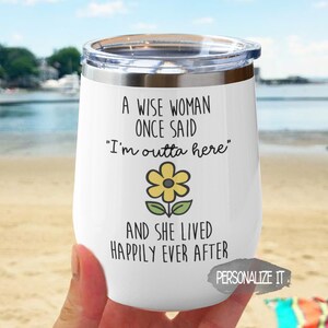 May include: White stainless steel wine tumbler with a yellow flower and the text "A wise woman once said "I'm outta here" and she lived happily ever after".