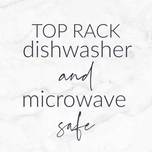 May include: Text on a white marble background that reads "Top rack dishwasher and microwave safe".