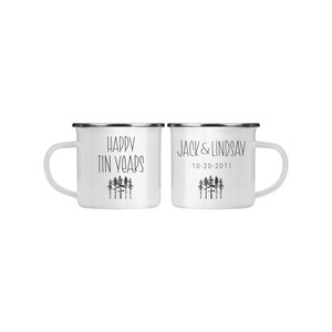 May include: Two white enamel mugs with black text and a forest silhouette. One mug says "Happy Tin Years" and the other says "Jack & Lindsay 10-20-2011".