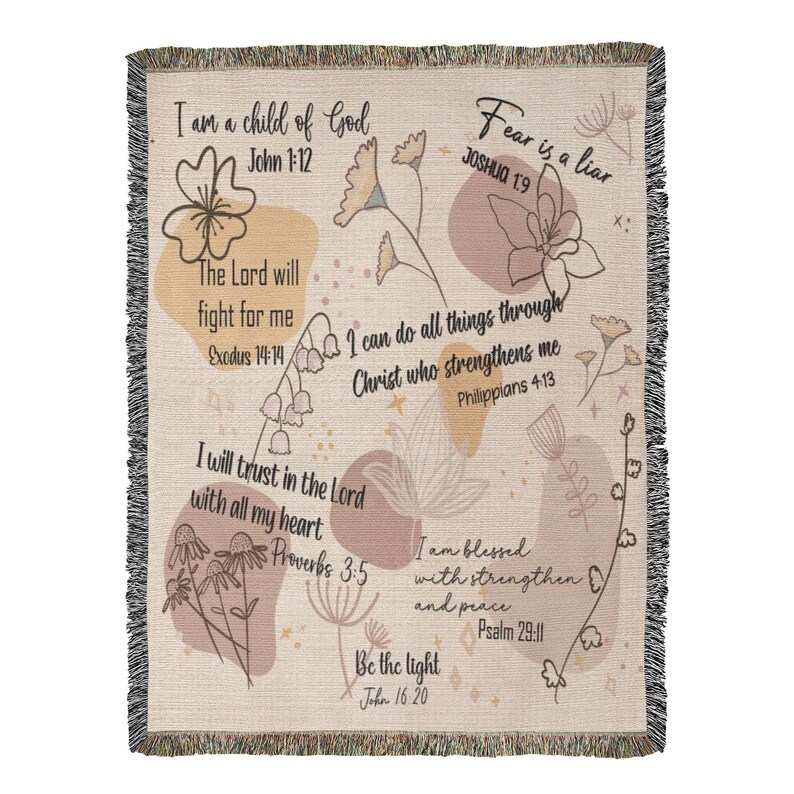May include: Woven throw blanket with a cream background, featuring floral illustrations and inspirational quotes in black text. The design includes quotes like "Fear is a liar" and "I am a child of God". The blanket has a fringed edge.