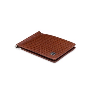 May include: A brown leather money clip wallet with a textured pattern. The wallet has a silver money clip and a small logo on the front.