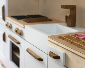 A wooden kitchen for children in an original style, unique handicraft, solid and safe, natural wood