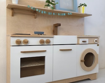 Wooden kitchen for children to play. A solid and safe toy for years. High-quality wooden kitchen for a boy and a girl